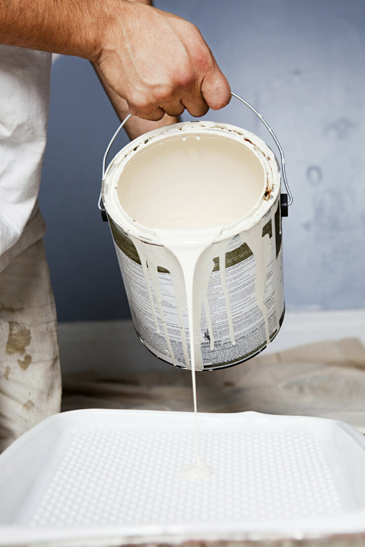 Man pouring paint