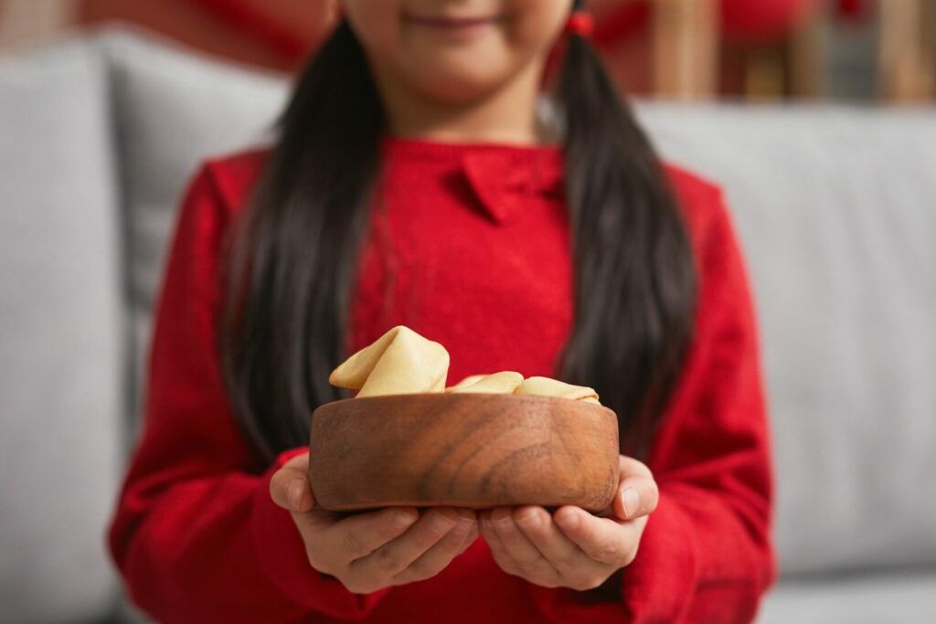 Girl Holding Fortune Cookies