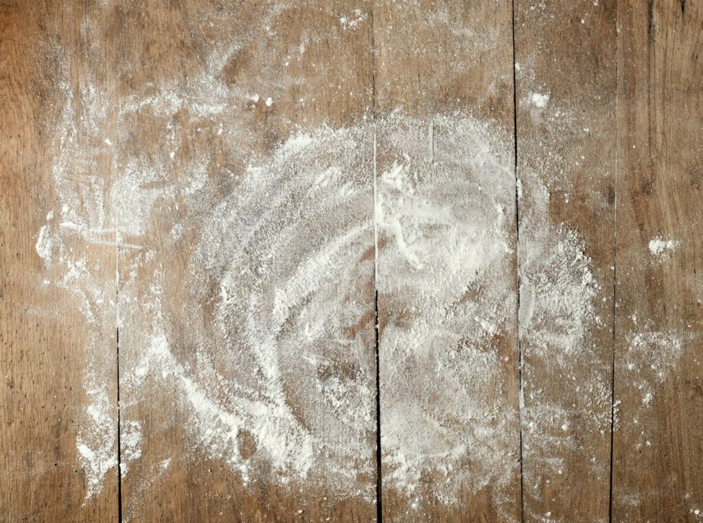 white flour on wooden table