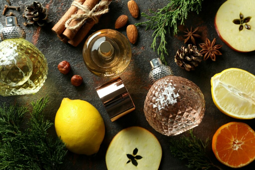 Composition with perfume bottles and different ingredients