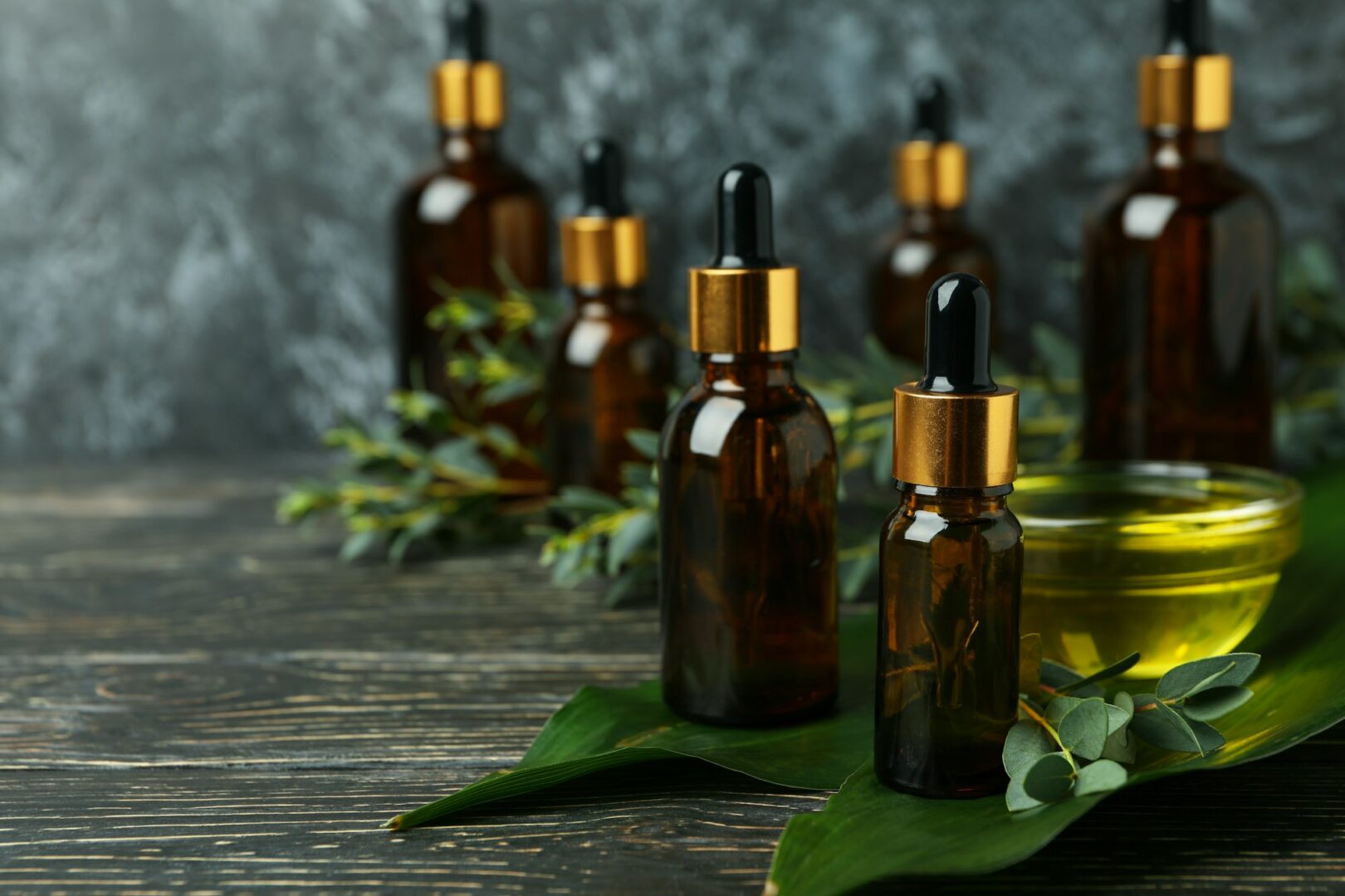 Concept of natural cosmetics with eucalyptus oil on wooden table