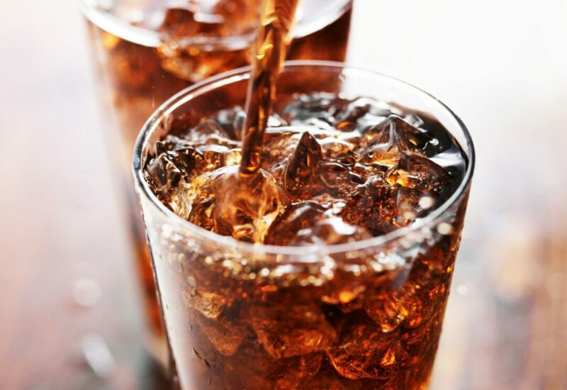 soft drink being poured into glass